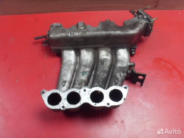 Коллектор впускной 7700867049 Volvo 440 1988-1996