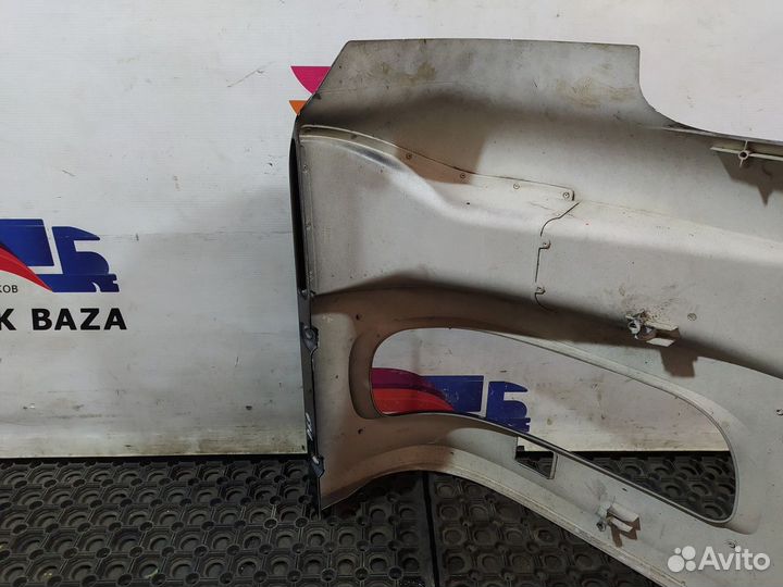 1398284 Облицовка фары левой Daf XF105