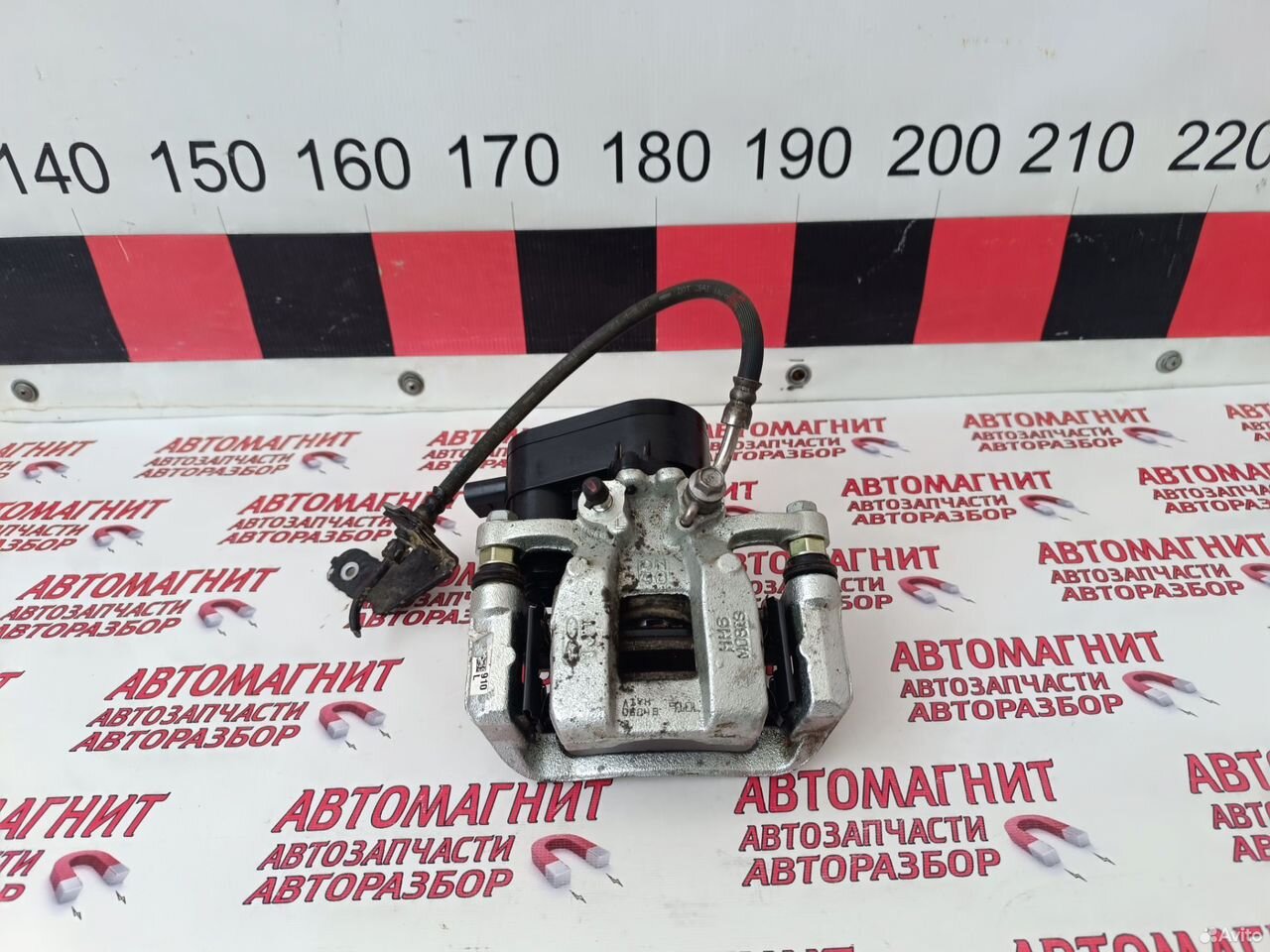 Супорт задний левый Киа Спортейдж 5 NQ 21-н.в