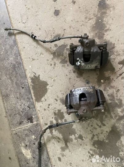 Суппорт тормозной передний Volkswagen Polo