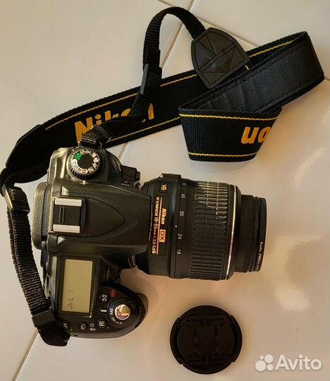Зеркальный фотоаппарат Nikon D90 с объективом