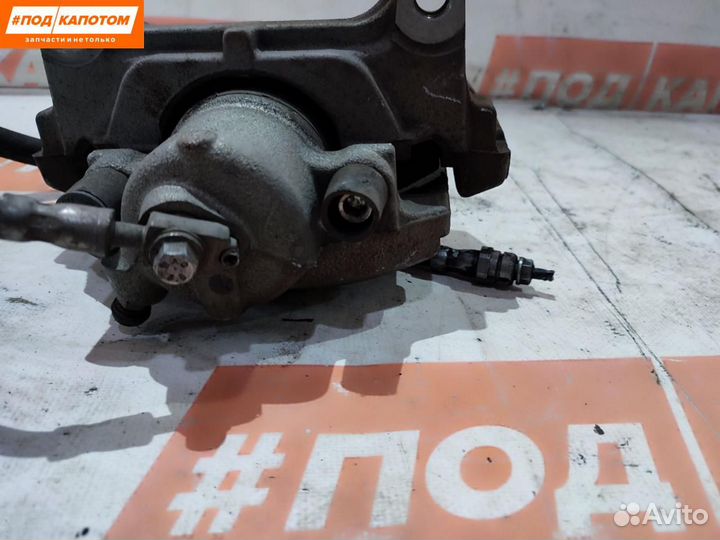 Суппорт тормозной передний левый Volkswagen Passat