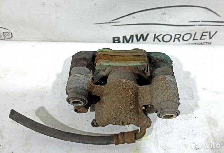 Суппорт тормозной задний левый Toyota RAV4 2