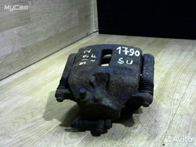 Суппорт тормозной передний левый Nissan Almera Tin