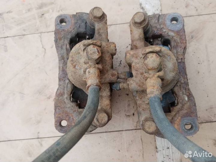 Суппорт тормозной задний Subaru Forester