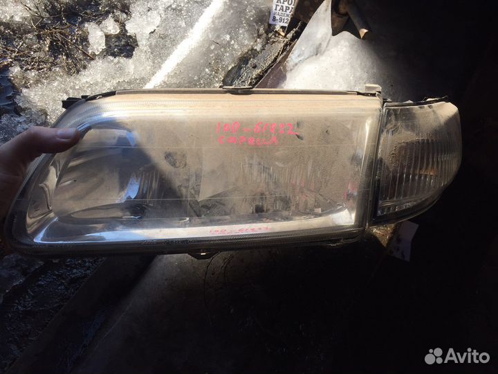 Фара левая mazda capella 100-61822