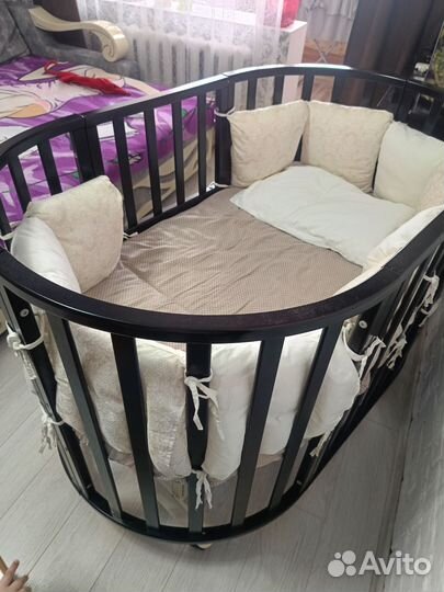 Детская кроватка с маятником круглая