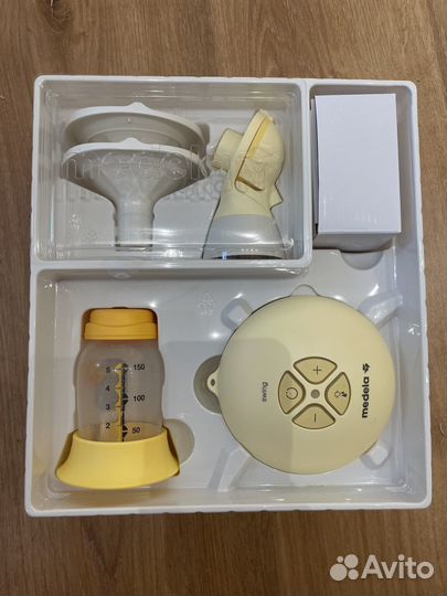 Молокоотсос medela электрический