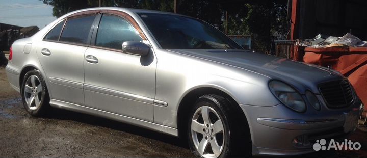 Трос стояночного тормоза Mercedes Benz W211 E