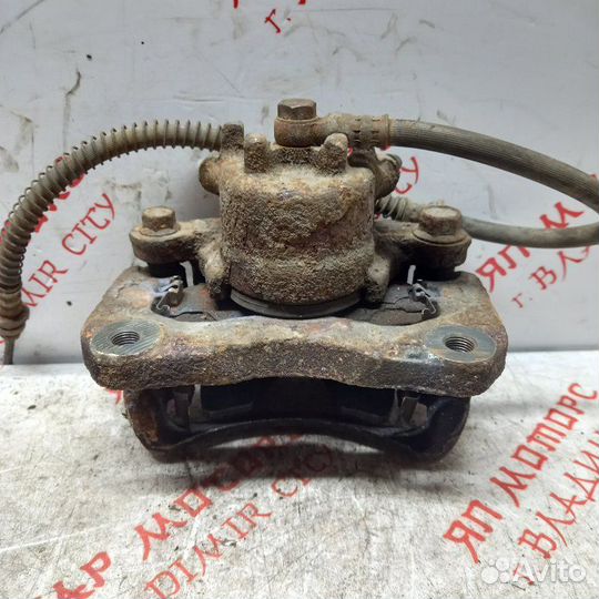 Суппорт тормозной передний Mitsubishi Lancer 9