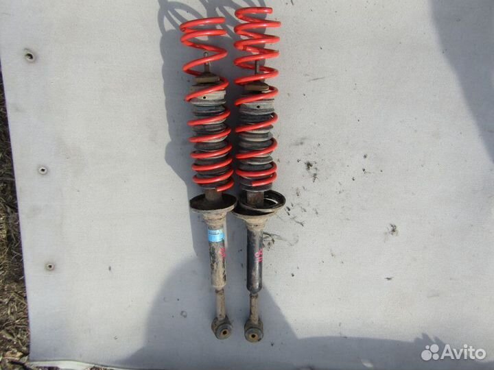 Задний амортизатор Мазда Демио 1