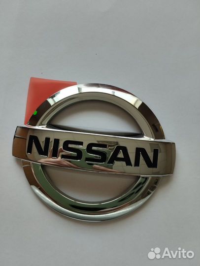 Эмблема Nissan