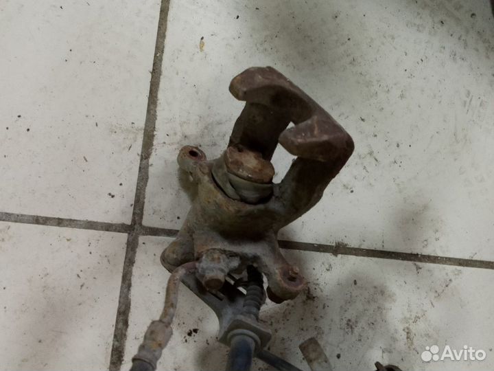 Суппорт задний лев/прав Kia Rio III