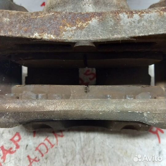 Суппорт тормозной передний правый Nissan Teana J31