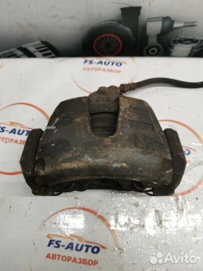 Суппорт тормозной передний левый Mazda 3 седан BK