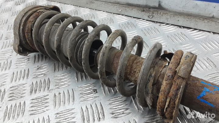 Стойка амортизатора заднего левого Mitsubishi Cari