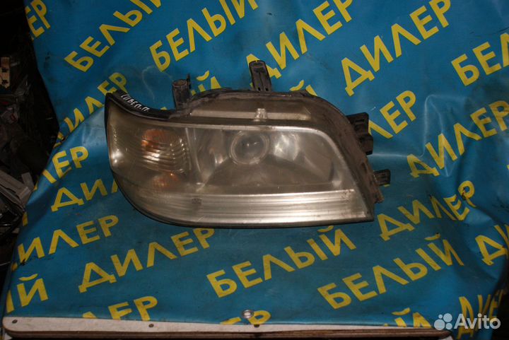 Фара Nissan Cube