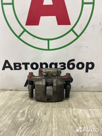 Суппорт тормозной задний левый Mitsubishi Lancer