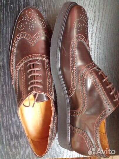 Новые кожаные ботинки