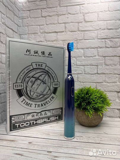 Электрическая зубная щетка