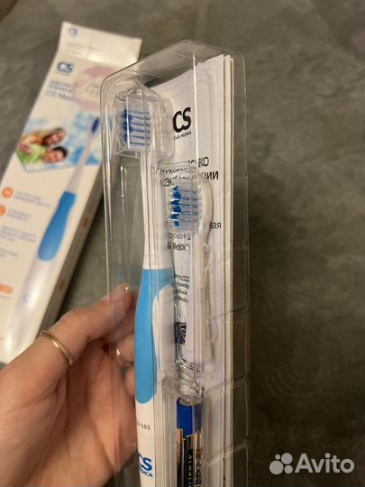 Электрическая зубная щетка