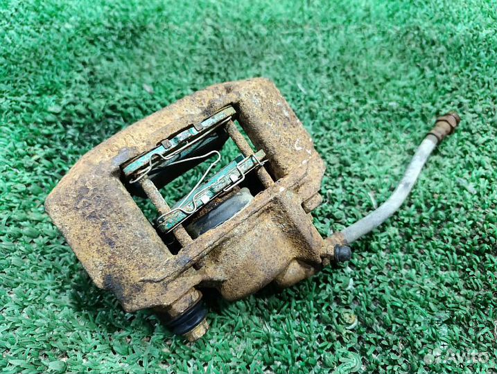 Суппорт тормозной задний левый Mitsubishi Pajero Sport