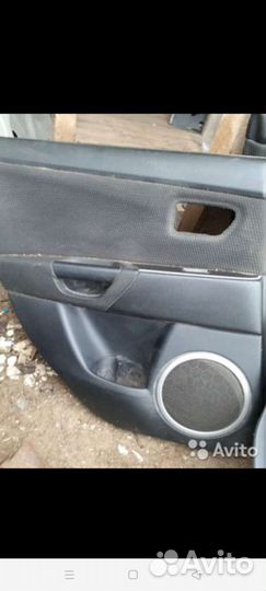 Обшивка двери Maздa 3 BK