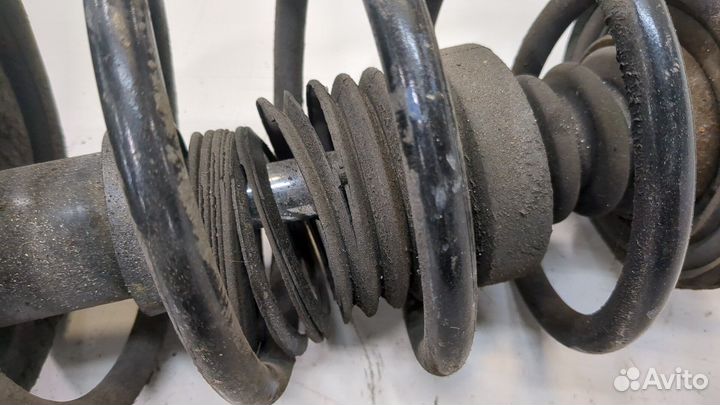 Амортизатор подвески левый передний Nissan Almera N16