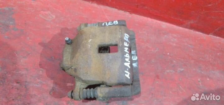 Суппорт передний левый Nissan Almera (N16)