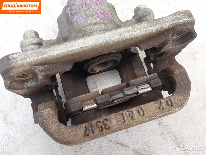 Суппорт тормозной задний левый Nissan Teana J32