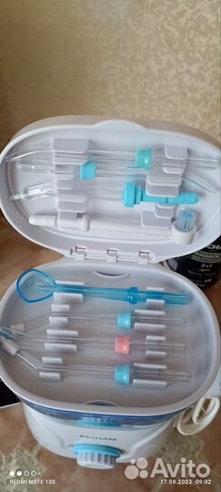 Ирригатор новый + жидкость для ирригатора