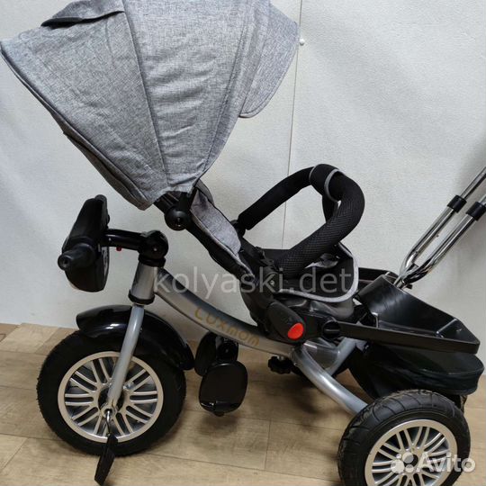 Трехколесный велосипед-коляска BMW