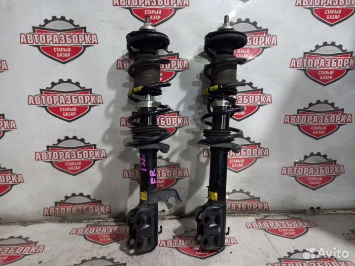 Стойка передняя Nissan March K13 HR12DE 2011