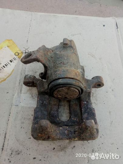 Суппорт задний левый Volkswagen Passat