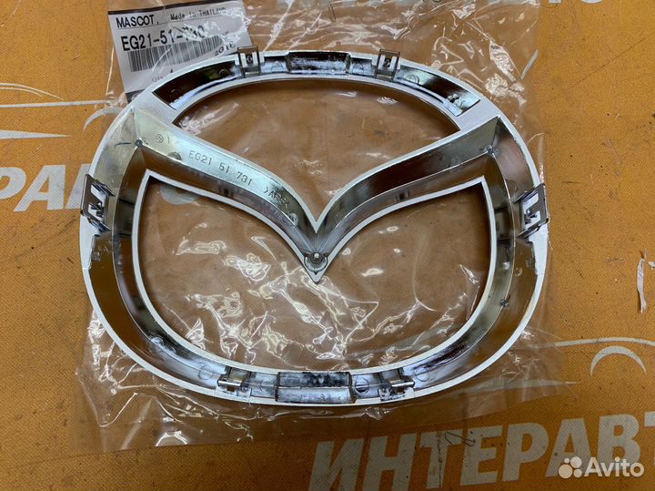 Эмблема решетки радиатора Mazda CX 7