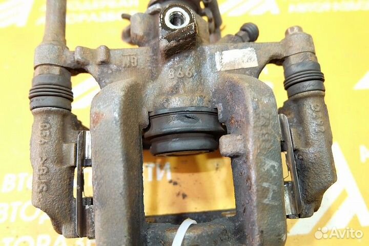 Суппорт тормозной задний правый Opel Astra J