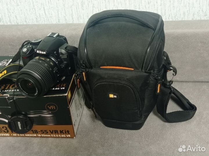 Зеркальный фотоаппарат Nikon D3100 с объективом