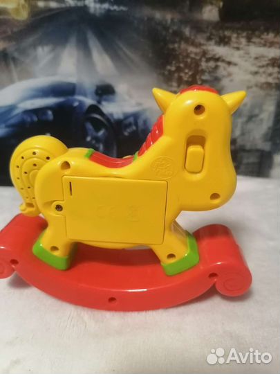 Игрушка лошадка поющая