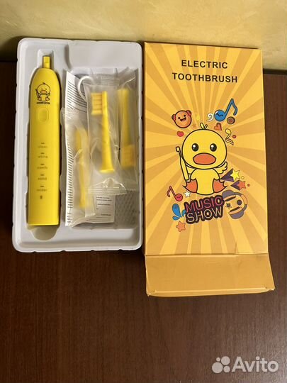 Электрическая зубная щетка