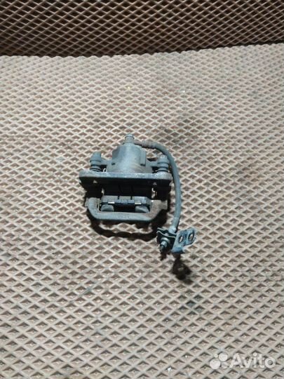 Суппорт тормозной задний левый Nissan X-Trail T31