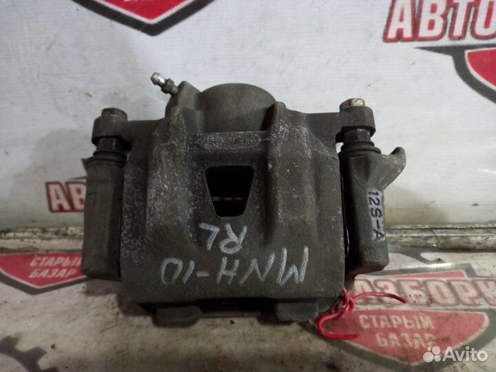 Суппорт тормозной задний левый Toyota Alphard