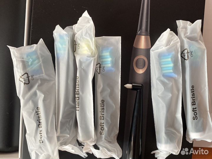 Электрическая зубная щетка