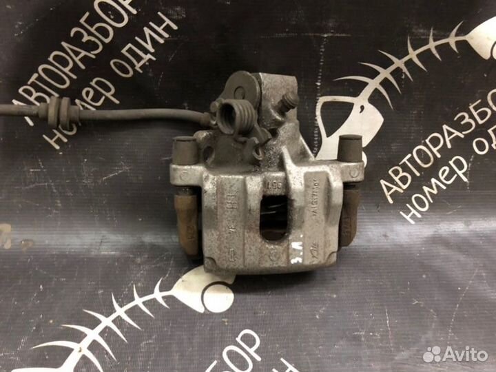 Суппорт тормозной задний левый Ford Focus 3