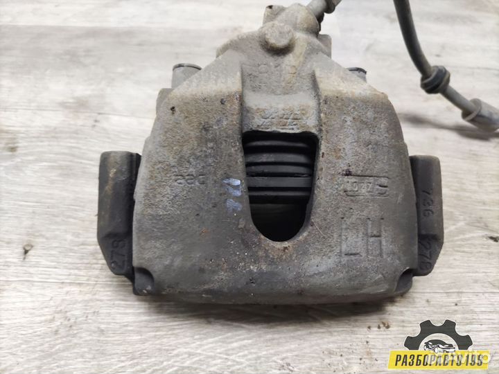 Суппорт тормозной передний левый Ford Focus II 20