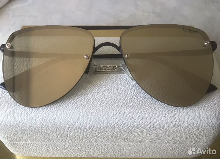 Солнцезащитные очки брендовые