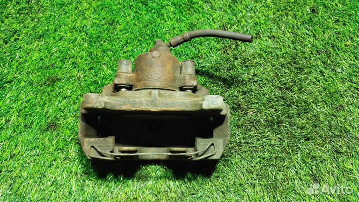 Суппорт тормозной Volkswagen Passat (B6) VI