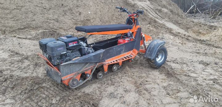 Мотобуксировщик с колесно лыжным модулем