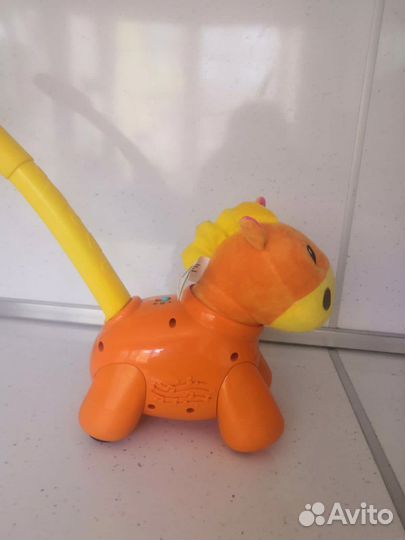 Игрушка-каталка детская музыкальная Динозавр