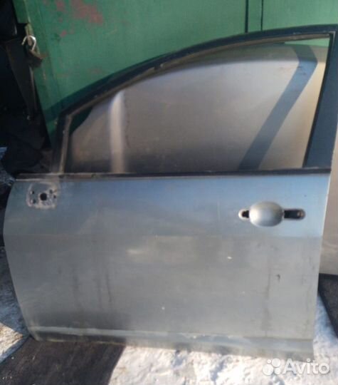 Дверь передняя левая Nissan Tiida (европа)