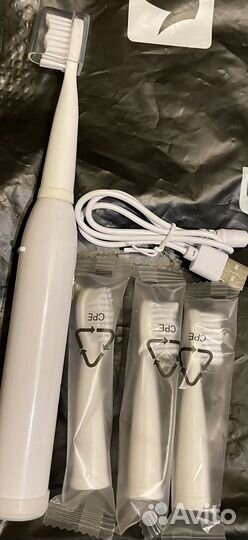 Электрическая зубная щетка